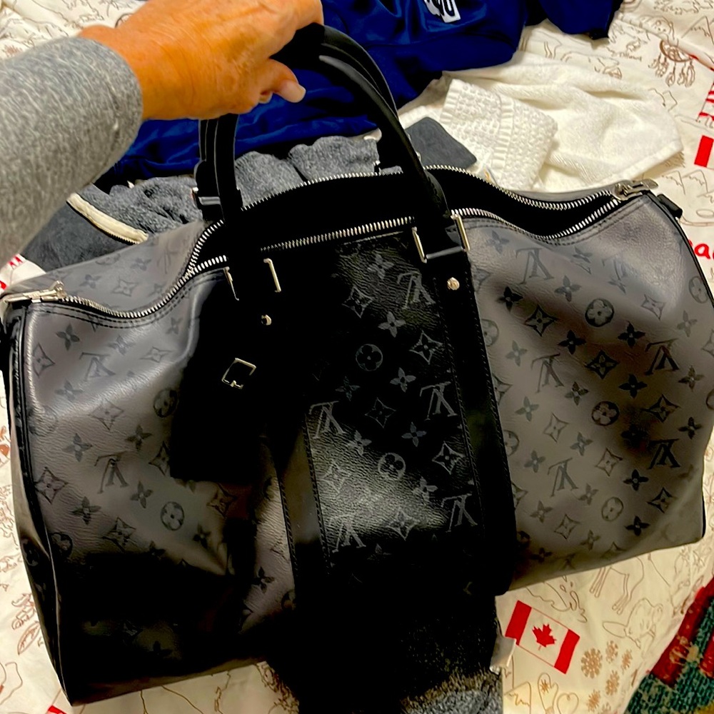 Duffel bag. Comes with strap. Beautiful bag